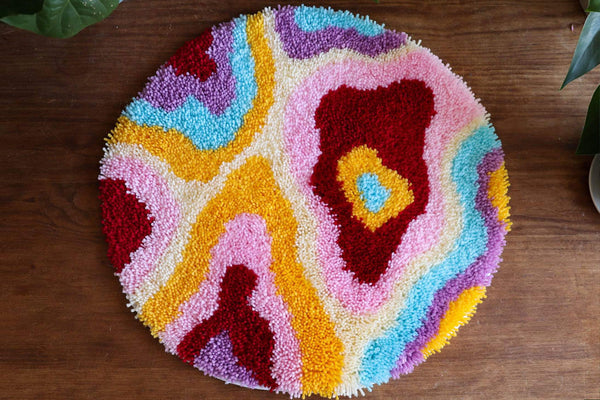Introducing our DIY Psychedelia Latch Hook Rug Making Kit – the ultimate creative escape that brings joy, relaxation, and stunning home decor all in one package. Unleash your inner artist and embark on a mesmerizing journey of rug crafting like no other.  Crafted with meticulous attention to detail, this kit includes everything you need to create a one-of-a-kind masterpiece. Our vibrant, high-quality yarn and durable canvas provide the perfect canvas for your imagination to run wild. 
