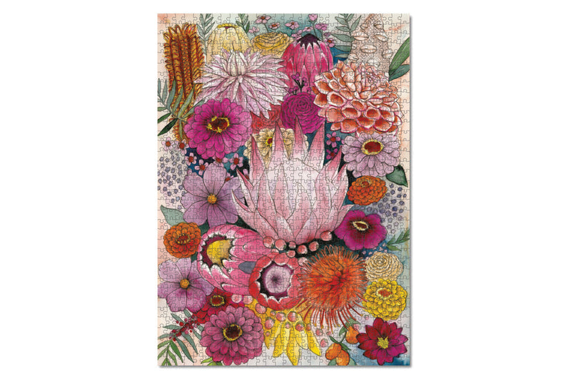 Experience the beauty of "Jade" - a lively and stunning 1000-piece jigsaw puzzle named after the artist's bubbly and bright friend. The artwork features an array of vibrant flowers, including protea, banksia, zinnia, ranunculus, cosmos, and dahlia, set against a captivating watery peach and teal backdrop.