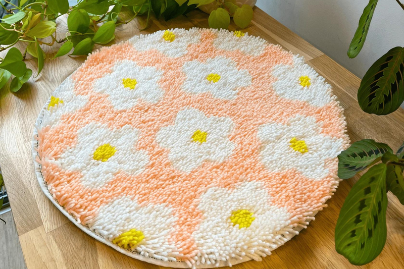 Our DAISY FLOWER BOMB RUG MAKING KIT is the ideal method to accomplish neutrals without the 'neutral'.  With our simple DIY kits, we're all about making creativity accessible!  And we mean simple. With a high-quality pre-backed rug base (no gluing or sewing required) and only one technique to master, they're as simple as pie.  We also believe in liking what you make! Your rug will become a cherished piece of home decor. You'll have great memories not only making it, but also using it!