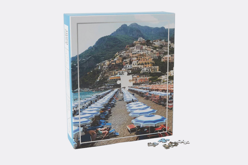 Experience the beauty of Positano, Italy, with this high-quality 1000-piece puzzle. The puzzle features a vibrant photograph of the picturesque town perched on the cliffs of the Mediterranean Sea. It's the perfect way to relax and unwind, or to enjoy a fun activity with family and friends.